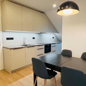 New sunny rooftop apartment with a terrace 10-15 minutes drive from city centre