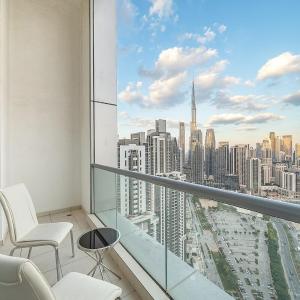 Elegant 2BR with Burj Views, Pool, Gym, and Quick Metro Access