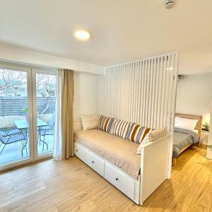 Minimalist Seaside Apartment with Private Patio and Parking - Blue Zone Homes