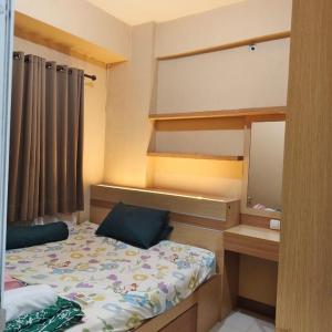 Green pramuka by Santoso Family