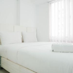 Elegant 2BR at Bassura City Apartment By Travelio