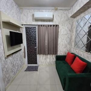 Green pramuka by Santoso Family