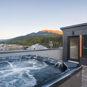Downtown Loft with Rooftop Hot Tub by StayIn