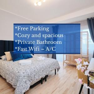 Camera con bagno privato, balcone, parcheggio gratis, 20 min dal Colosseo