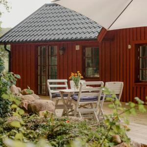 Quaint Barn Nestled Between Sea And Forest