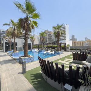 Vogue Vacation Homes, JVC Chaimaa Avenue near Circle Mall, One Bedroom Apartment with Balcony and City View, Access to all Amenities