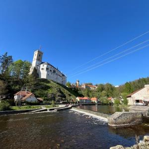 A room by a weir with a view of Rožmberk Castle