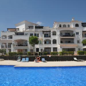 Hacienda Riquelme Golf Retreat with pool view and sunny terrace