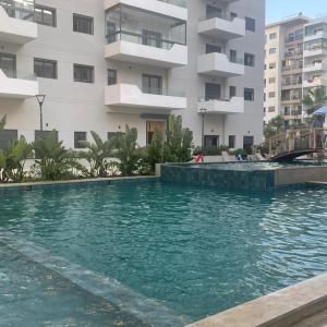 Ocean park , for married couples and families only , Luxury fully furnished one bedroom flat next to zenata beach with five avialable swimming pool at the compound