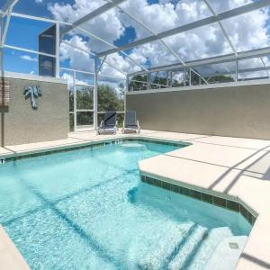Family Friendly 4BR Retreat with Heated Pool Access near Disney World