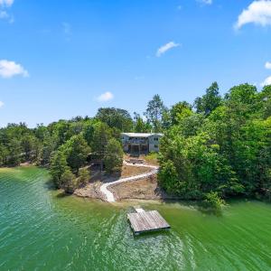 Rustic Lakefront Home with Beach