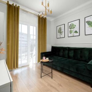 Dark Green Apartment in Wrocław Center with Desk and Balcony by Noclegi Renters