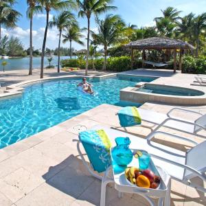 Just for Fun - Beachfront Paradise with Pool and Family-Friendly Amenities