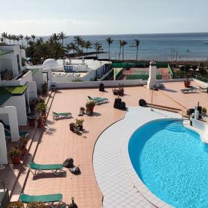 Lanzarote Beachfront Apartment on Las Cucharas Beach with a sea view