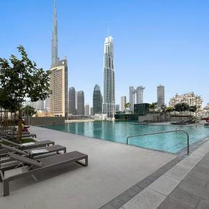 Vogue Vacation Homes, Downtown Views II with Direct Access to Dubai Mall Via a Climate Controlled Bridge, One Bedroom Apartment with Balcony and City View