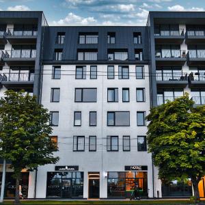 Modern Central Riga Apartment with Balcony, Gym, Parking & AC