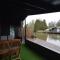 Modern chalet in a small park located right along a fishing pond - Geel