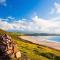 Putsborough Manor 3 Self Catering Cottages with Beach a short walk, dog friendly all year, On site Tennis, Play Area, Paddock, Spa baths, BBQ, Private Gardens, Superfast WIFI