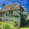Putsborough Manor 3 Self Catering Cottages with Beach a short walk, dog friendly all year, On site Tennis, Play Area, Paddock, Spa baths, BBQ, Private Gardens, Superfast WIFI