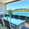 Foto: Villa 4 The Edge on Hamilton Island Waterfront High Ceilings Modern Amenities Plus Buggy