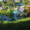 PRIVATE HOT TUB, POOL BBQ fenced retreat, a mile walk from beaches pet Friendly