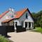 Foto: Holiday home Dijkstelweg 46 - Ouddorp with garden and covered terrace, near the beach 12/52