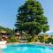 Apartment on Lake Garda with pebble beach pier for boat three swimming pools