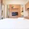Modern Studio at Green Pramuka City Apartment near to Shopping Center By Travelio