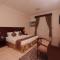 Foto: Belle Vue Inn Hotel & Suites 16/53