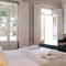 Dona Emília Guest House & Studio Apartment Building
