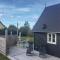 Foto: Three-Bedroom Holiday Home in Svaneke 1/23