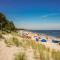 Ferienwohnung Tine mit Balkon, Fahrrädern und Strandkorb im Sommer
