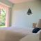 Villa in protected space in front of the sea