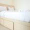 Comfort and Cozy 2BR Apartment Parahyangan Residence By Travelio