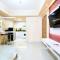 Bright and Stylish 1BR The Oasis Apartment Cikarang By Travelio