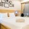 Modern Elegant Studio Grand Kamala Lagoon Apartment By Travelio