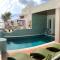 Foto: Beachfront Three Bedroom Villa 5/39