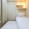 Connect to Pool 2BR Apartment at Bassura City By Travelio