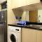 Artistic Studio Apartment at The Oasis Cikarang By Travelio