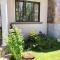 Cardamon Villa is a 2 bedroom with 1 bathroom and seperate toilet detached house with AC and swimming pool , 5 minutes walk from Flic en Flac public beach