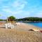 Beach house IVE with jacuzzi, pool, playground and bbq in an olive grove with a beach, Pomer - Istria - Pomer