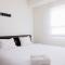 Simply Furnished 1BR at Paramount Skyline Apartment By Travelio