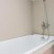 Simply Furnished 1BR at Paramount Skyline Apartment By Travelio