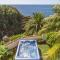 Villa in protected space in front of the sea