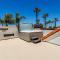 The White House with spa, bikes and steps to the beach and down town main street shops and dining