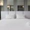 Bright Studio @ Tamansari La Grande Apartment By Travelio