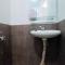 Homey and Relaxing 2BR Green Pramuka City Apartment By Travelio