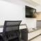 1BR with Working Space The Oasis Cikarang By Travelio
