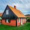 Foto: Three-Bedroom Holiday home in Svaneke 2 9/25