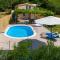 Holiday Home Rupotina with a large yard, pool and a beautiful view